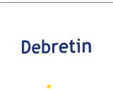 Niebieski napis "Debretin" na białym tle. Czy przyjmować Debretin przed czy po jedzeniu?